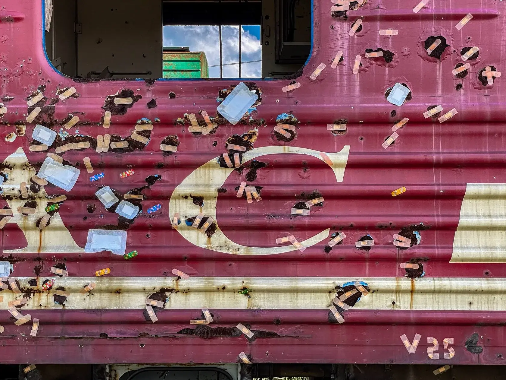 All Will Pass, installation, wagon covered in adhesive plasters, view 1